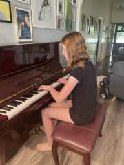 Ruby playing the piano. Asher plays too