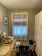 Upstairs Bathroom with tub and shower.