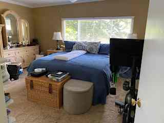 Master bedroom with Peloton bike.
