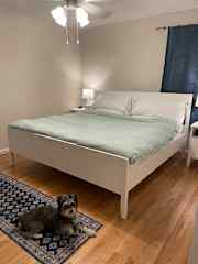 king bed with crisp cotton bedding.