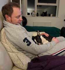 Andy giving cuddles in front of the TV for movie night.