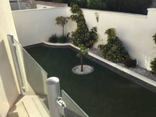 This is the side view with an entrance to the back garden