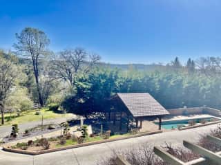 View of pool area from deck off living room