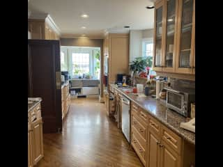 Kitchen with gas range, microwave, toaster oven and Keurig coffee maker