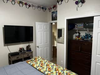 Guest room 1 - tv, closet with dresser