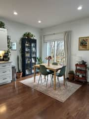 Dining area with sliding glass door to deck and backyard