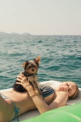 Me on a pedalo boat off Elba Island in Tuscany with Tony when he was just a puppy!