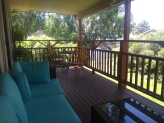 Covered patio with sectional sofa and dinning area