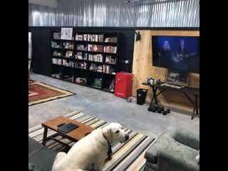 I call this my barndo. It's an upgraded garage with heat and cooling, and it's where I have my one TV. It's a big room in a separate building. You're free to use, but be conscious of heating--turn it way down (to the lowest setting) when not using it.