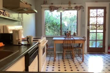 This is the kitchen facing the back window.