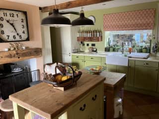 Kitchen with downstairs toilet and utility room to the left.