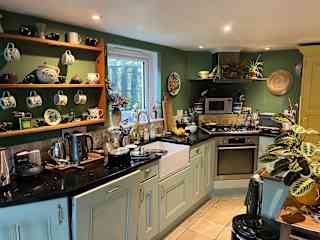 Kitchen with concealed island unit