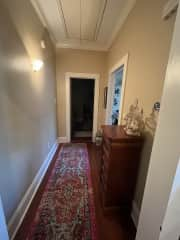 hallway connecting kitchen and 1st bedroom (1st bathroom is off this hallway)