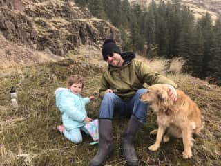 Taking a family hike in the mountains .