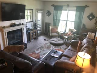 This is the living room with a fireplace, and sleeper sofa when needed, and overlooks a great little reservoir. The door pictured leads to the outdoor patio.