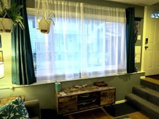 View from the living space. You can see the courtyard with other residences from here. Close the dark curtains for full privacy.