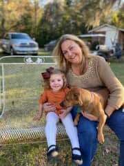 Susie, Pam, and granddaughter on the swing in the back yard.