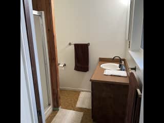 Downstairs bath. Not remodeled but clean and functional