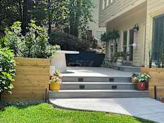 Enjoy our newly renovated backyard space including a 6-person dining table and chairs, rocking chairs, a 6-person fire pit and Weber gas grill.