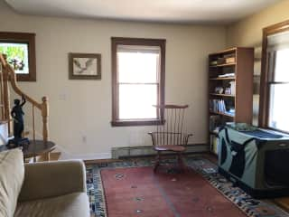 The entrance is into a foyer and then this front room, which Eva uses freely. (That little sofa is mostly hers.)