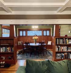 Living room opens to the large dining room with seating for eight (complete with one of our two pups)