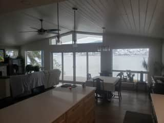 View to the lake from the kitchen, dining and living room.