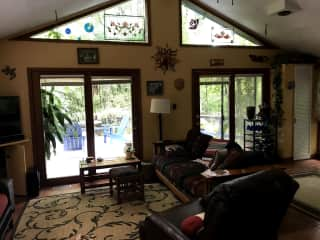 Sunroom/TV room/kitchen on other side.