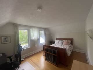 Spare bedroom - This is where you will sleep. It has a  queen bed, a small dresser, and a desk with an office chair.