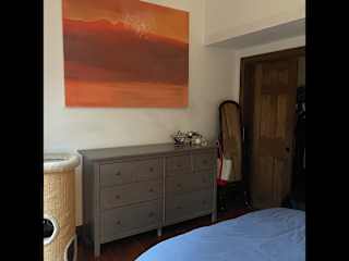 bedroom with original art.