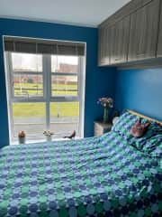 This is the guest bedroom where you’ll stay. You can lie in bed and see the green space and the birds swimming on the water
