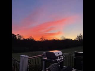 Sunset off of the deck with the gas grill, 6 person table and two large chairs overlooking the backyard. Cushions located in the wine deck area.