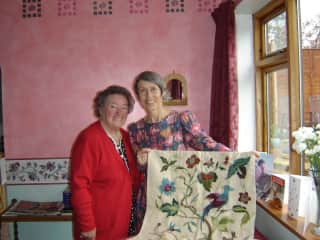 Showing off my embroidery to my mother