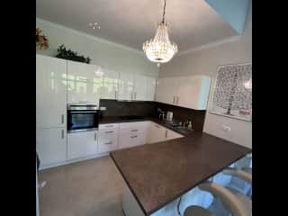 Fully-fitted kitchen open to the living room