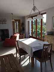 The light open plan lounge / kitchen with two sets of French doors.  The cats sleep here at night