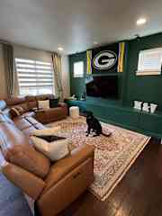 Livingroom on the second floor with reclining couch, surround sound and 70" TV with apps.