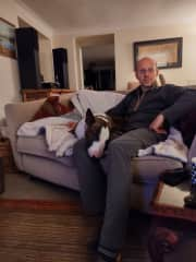 Nick and Bruce the English Bull Terrier watching TV after a busy day exploring