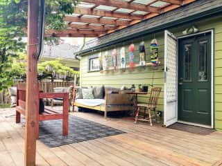 Back porch with covered room for keeping you dry from the rain, cool from the heat