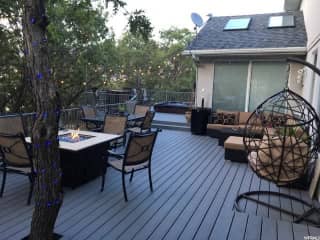 Deck with hot tub in the back. If it is ready for winter, all furniture will be stored away.