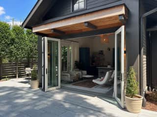 The pool house doors open wide on a nice day.