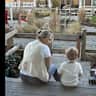 House sit pet parent - Enjoy our covered porch at sunset in our quaint beach community