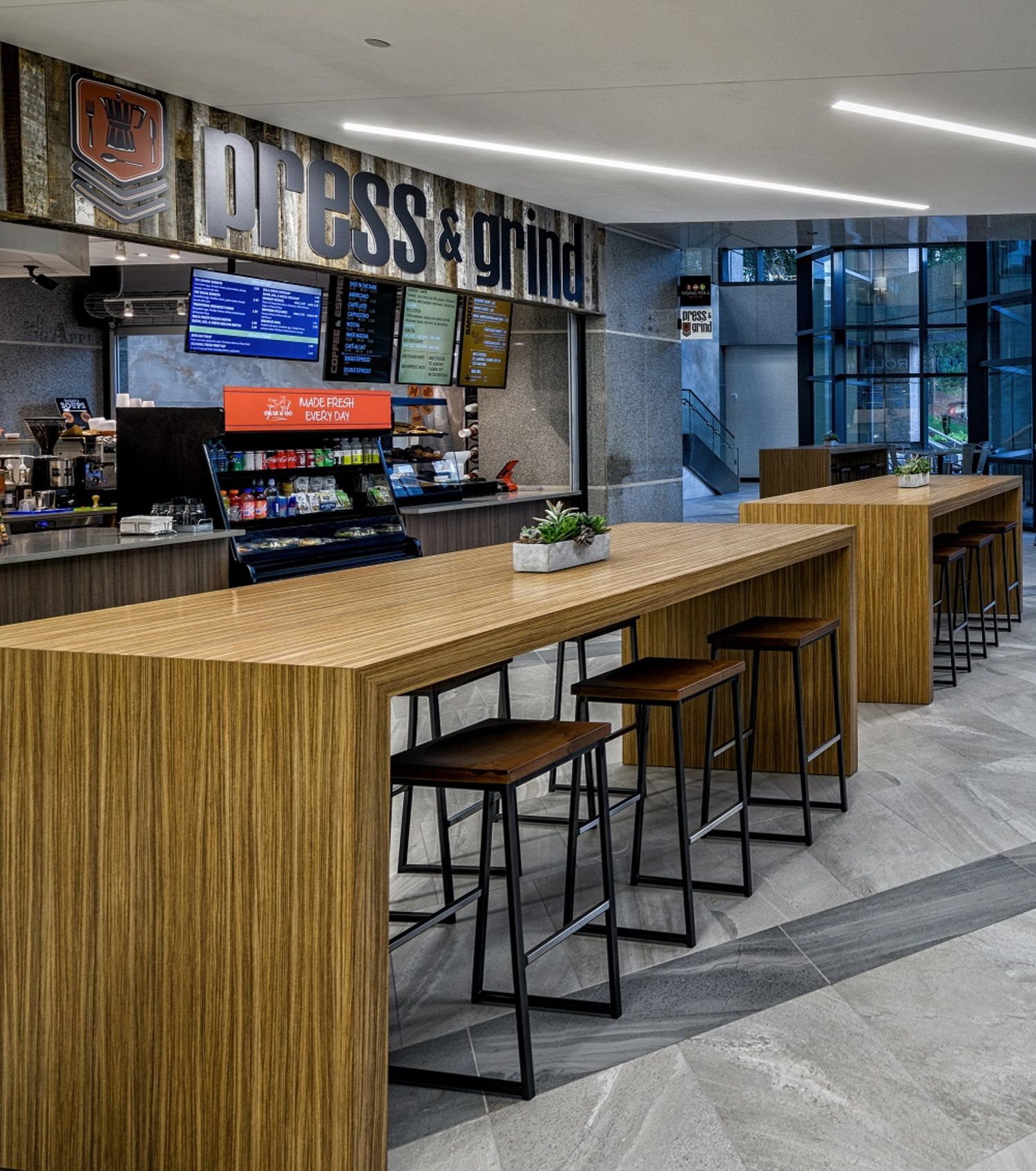 <h2><span class="text-size-header-32"><em>PRESS AND GRIND</em></span></h2> at 7000 Central Parkway