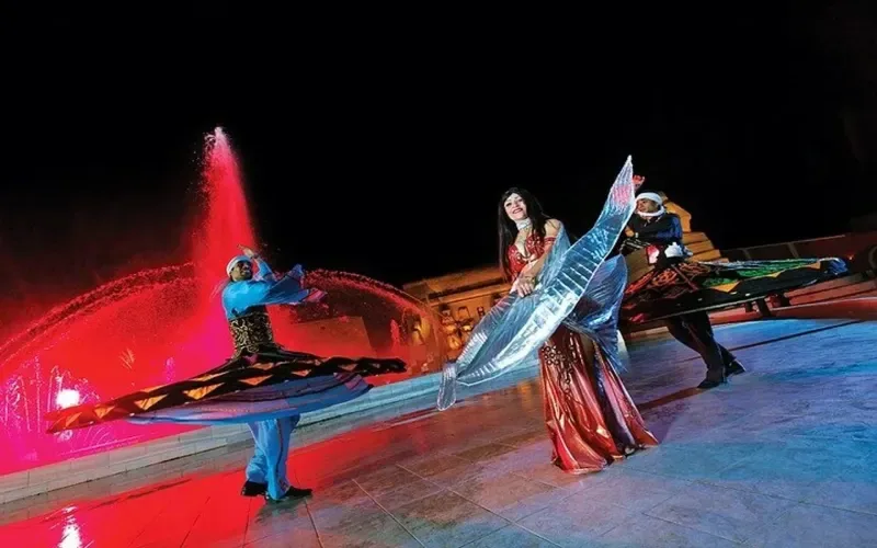 Tanoura performance Alf Leila Wa Leila Sharm — whirling dervish show under stage lighting