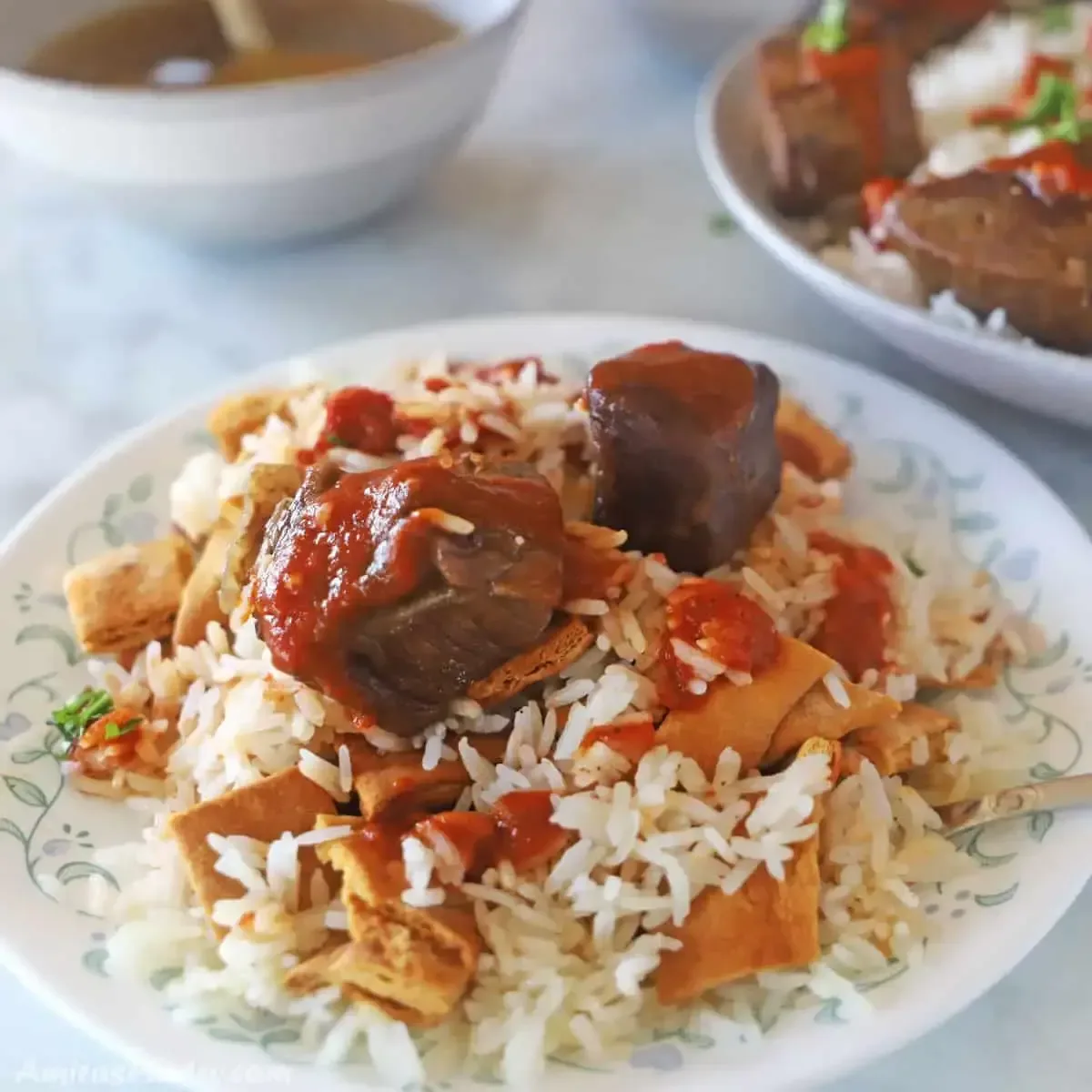 Koshari — Egypt's national dish, rice lentils pasta chickpeas crispy onions tomato sauce Cairo street food 2026