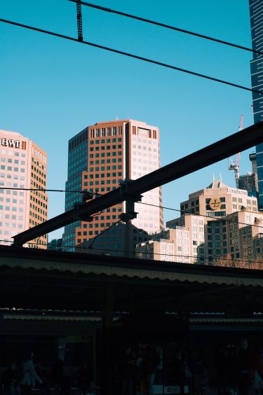 A view of the sky and distant buildings from the platform of Flinders Street Railway Station