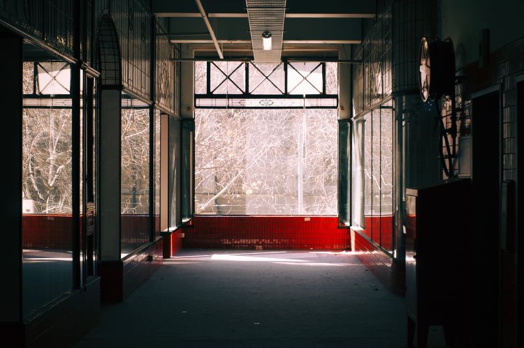 A corridor inside The Nicholas Building, looking down at a window