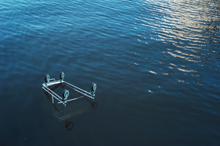 An upside down shopping trolly floating in the Yarra River