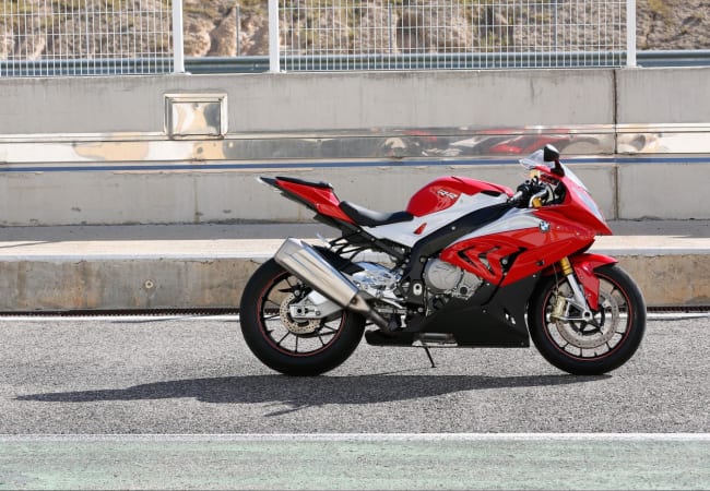Red BMW sportbike motorcycle outside on asphalt | Twisted Road Motorcycle Rental