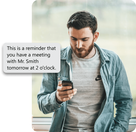 Person receiving a meeting reminder via sms