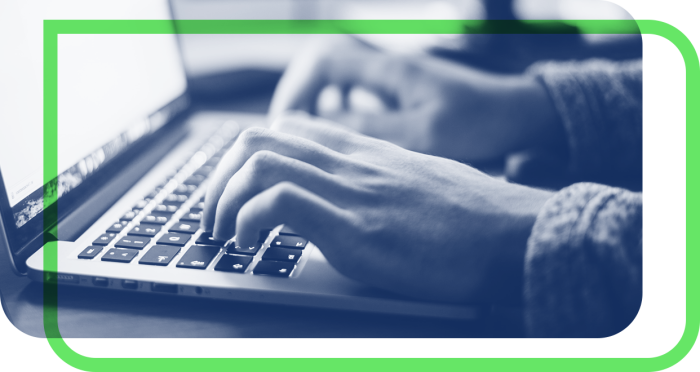 Person typing on laptop