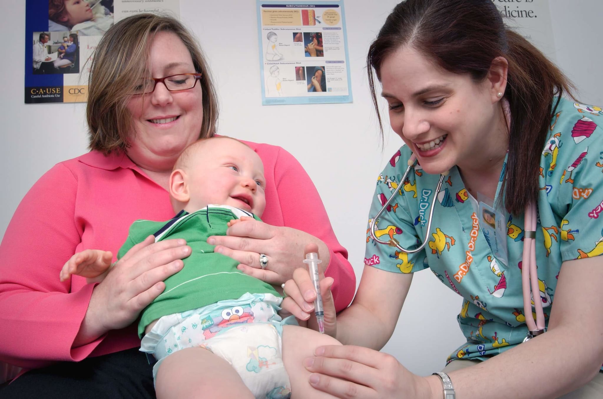 A paediatrician giving a baby a vaccine injection